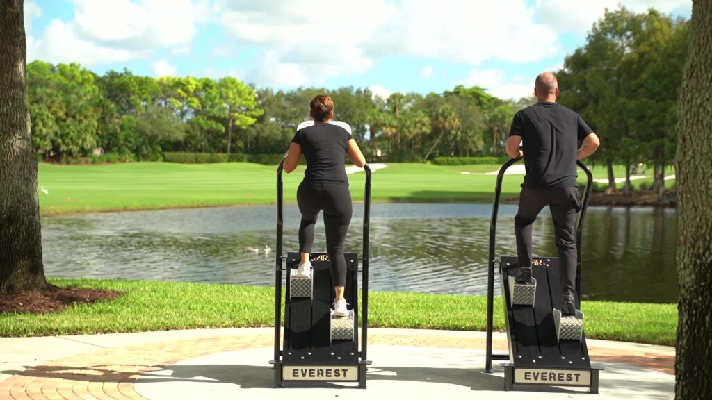 People exercising on Outdoor-Fit Apollo outdoor fitness equipment